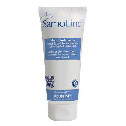 A white tube Dr. Schnell SAMOLIND skin protection by DR.SCHNELL GmbH & Co. KGaA with blue accents and German/English text. The cream protects stressed skin from moisture and contains Vitamin E.