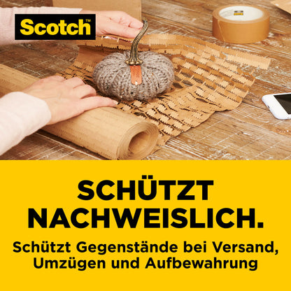 A small decorative pumpkin is safely wrapped in Scotch™ Cushion Lock™ protective packaging (30.4 cm x 9.14 m) from 3M Deutschland GmbH. Tape and bubble wrap are on the table.