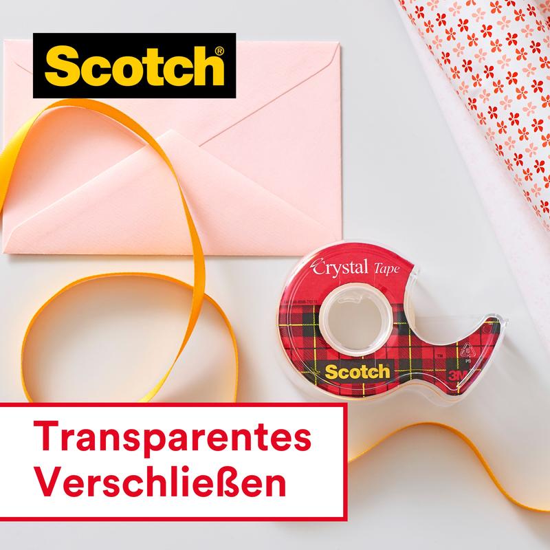 Next to an orange ribbon, a pink envelope, and wrapping paper lies a value pack of Scotch® Crystal Tape (8 rolls, 19 mm x 33 m) from 3M Deutschland GmbH. The inscription: "Transparent sealing - perfect with transparent tape."