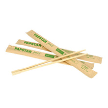 Three pairs of PAPSTAR chopsticks "pure" 23 cm, each individually wrapped in paper sleeves with green print, as from the 50-pack by PAPSTAR GmbH, are depicted on a white background.