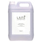 A 5-liter canister made of transparent plastic with a handle and screw cap, labeled "LAPE Earth Collection Sakura Sea Breeze Body Wash & Shampoo" by Diversey Deutschland GmbH & Co. OHG. Eco-certified, cherry blossom and sea breeze scent.