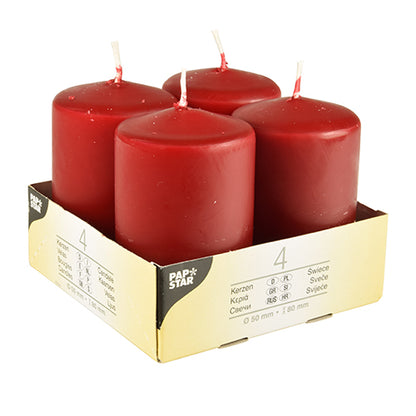 Four ivory Starpak pillar candles (Ø 50 mm, 80 mm, flat top) stand upright in a beige cardboard holder with the inscription "Starpak". The package shows product details, the quantity 4, and emphasizes the use of high-quality wax.