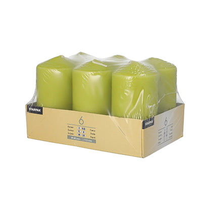 The Starpak 6 pillar candles Ø 60 mm · 115 mm set consists of high-quality green candles, packed in clear foil and a cardboard tray with product information – for extra long burning time.