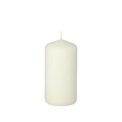 The Starpak pillar candle with extra long burning time (Ø 50 mm, 100 mm) stands upright, unlit, against a white background.