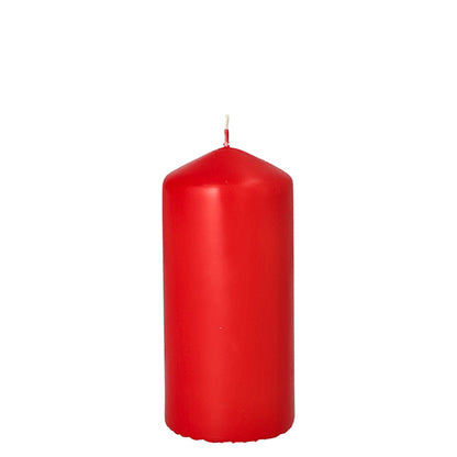 A single, unlit Starpak pillar candle with extra long burning time (Ø 60 mm, 130 mm) with a smooth red surface and centered white wick stands upright against a plain white background.