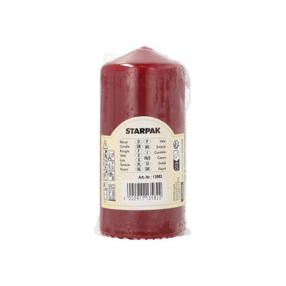 A red Starpak pillar candle (Ø 60 mm, 130 mm) with extra long burning time is packaged in transparent plastic and provided with a beige label with brand name, product details, barcode, and safety symbols for long use.