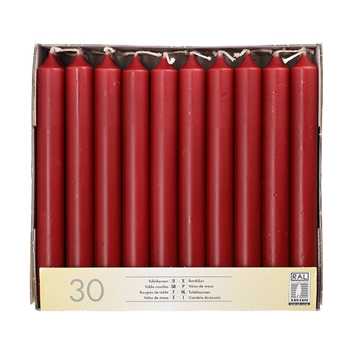 The Starpak 30 table candles Ø 2.1 cm · 19.6 cm are delivered in a box with a yellow Starpak label and RAL quality mark – perfect for festive table decoration.