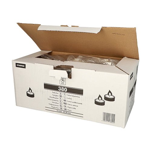 A white display box bearing the Starpak brand shows several tea lights with the lid open. The label reads “Starpak 380 Tea Lights Ø 39 mm · 15 mm white” and indicates that the box contains 380 tea lights.