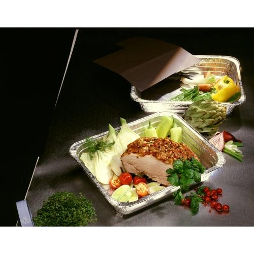 Three Starpak 3 Gastronorm containers made of aluminum (8.5 l, 8 cm x 32.6 cm x 52.7 cm) display vegetables like tomatoes, cabbage, artichoke, and bell peppers as well as a seasoned roast. Herbs and parsley lie next to the containers on the dark table.