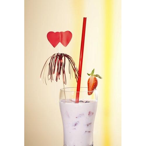 A glass of pink milkshake with ice, strawberries, a halved strawberry on the edge, a red straw, and PAPSTAR 100 decoration pick from PAPSTAR GmbH – perfect for buffets and stylish presentations against a light background.