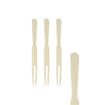 Four PAPSTAR finger food skewers "pure" (8.5 cm) made of wood lie vertically on a white background, three close together and one at the right edge - perfect party accessories from PAPSTAR GmbH, can with 500 pieces.