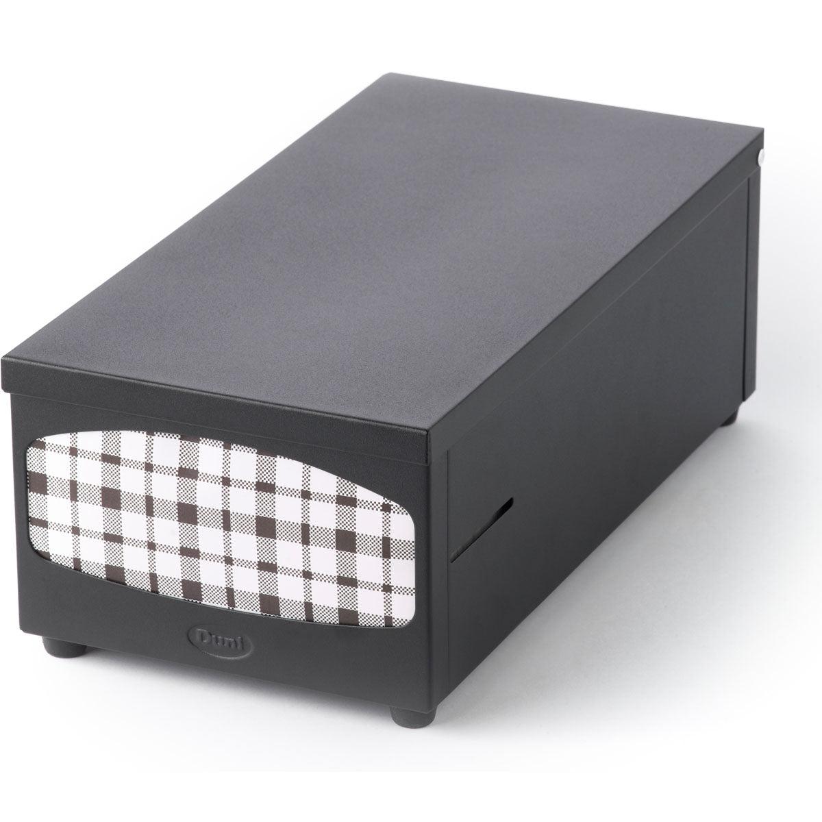 The Duni GmbH napkin dispenser 33er, black, is a rectangular table dispenser for napkins (1 piece) with a stylish checkered front panel in black and white and is presented on a white background.