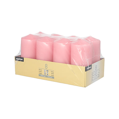 A pack of eight pink Starpak 8 pillar candles Ø 50 mm · 100 mm is presented in a cardboard tray, wrapped in clear plastic foil, and equipped with product information labels – ideal for creating a cozy atmosphere.