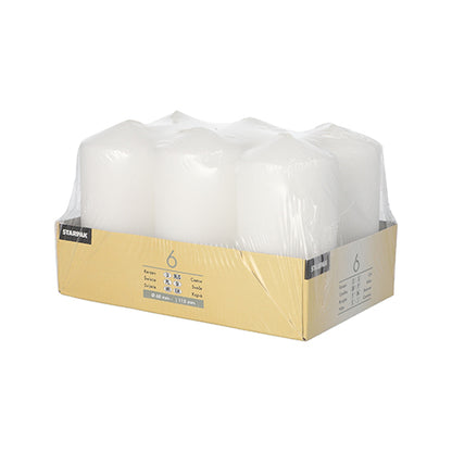The Starpak 6 pillar candles Ø 60 mm · 115 mm set includes white candles made from high-quality wax with long burning time, packed in clear foil and a yellow-beige cardboard tray with product information on the front.