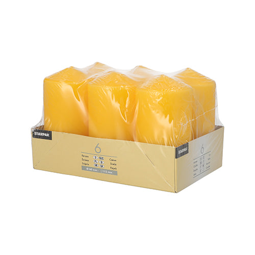 On a beige tray labeled 'Starpak' is a package wrapped in transparent plastic containing six Starpak 6 pillar candles Ø 60 mm · 115 mm made from high-quality wax, presented against a simple white background.