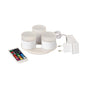 The Duni GmbH Mini Multicolour LED Set includes three small, round LEDs with a charging station, a white power adapter, and a remote control for different colors and functions - perfect for creative lighting.