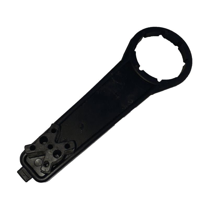 The key for the L-ring drum from Diversey Deutschland GmbH & Co. OHG is a black plastic tool with a round, notched end and a flat handle, ideal for tightening or loosening L-ring drum lids (1 piece per package).