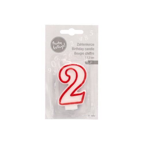A number candle from PAPSTAR GmbH, 7.3 cm, in the shape of the number 2 in white with a red edge, packaged on a plain light gray background. Multilingual packaging; ideal for birthdays and anniversaries.