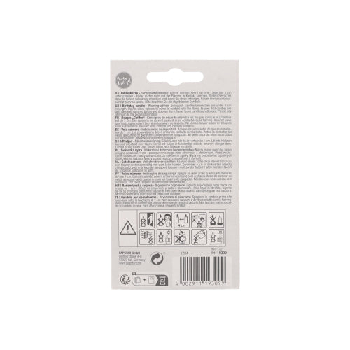Back of the PAPSTAR number candle 7.3 cm white with red border from PAPSTAR GmbH. Multilingual text, safety symbols, recycling symbols, barcode. Ideal for anniversaries and birthdays. Contains usage warnings and is equipped with a hole at the top for hanging.