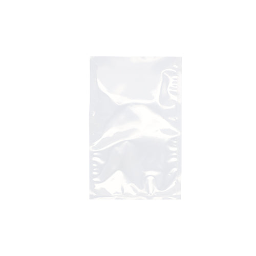 A clear Starpak 100 vacuum seal bag, PA/PE transparent, lies flat on a white background. With its sealed edges, this Starpak bag is ideal for vacuum sealing food with a chamber vacuum sealer.