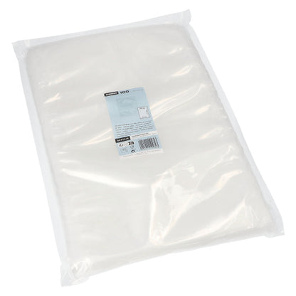 A transparent Starpak 100 vacuum bag holds a stack of white paper napkins, which have a blue and white label with product information in the center.