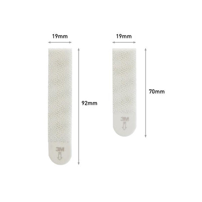 Two Command™ Picture Hanging Strips from 3M Deutschland GmbH (Sizes M 70x19mm, L 92x19mm) from the Value Pack 17209 are shown side by side - perfect for hanging pictures without nails or damage.