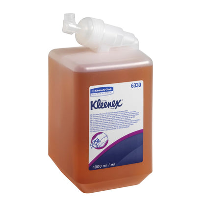 A 1L Caramel Kleenex® Ultra™ Wash Lotion cartridge from Kimberly-Clark GmbH is supplied with a white pump dispenser and a label with blue and purple text; available in 6 cartridges per box.