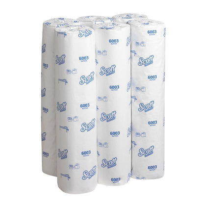 Six rolls of Scott® EXTRA medical rolls - White from Kimberly-Clark GmbH made from premium paper, in white packaging with blue lettering and logos, arranged upright next to each other.