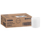 A brown box labeled "WypAll® Wettask™ PowerClean" by Kimberly-Clark GmbH stands next to a white roll. The box (6 rolls) contains 6 refill packs each with 60 sheets - ideal for professional cleaning, with product information and barcodes provided.