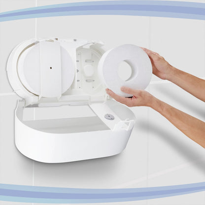 A person loads a Kimberly-Clark GmbH Aquarius™ toilet paper dispenser - central pull / white / Jumbo, with the lid open. The white tiled walls and blue curves in the background highlight the practical central dispenser design.