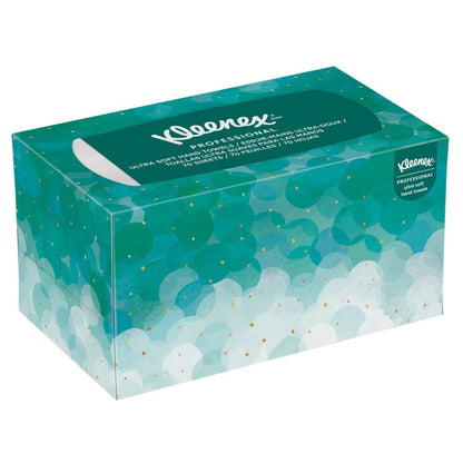 The Kleenex® Ultra™ Interfold Hand Towels (70 count, white, medium) from Kimberly-Clark GmbH come in a rectangular box with an abstract design in teal/blue and gold accents, featuring a white tissue dispenser slit—ideal for maintaining hand hygiene in professional settings.