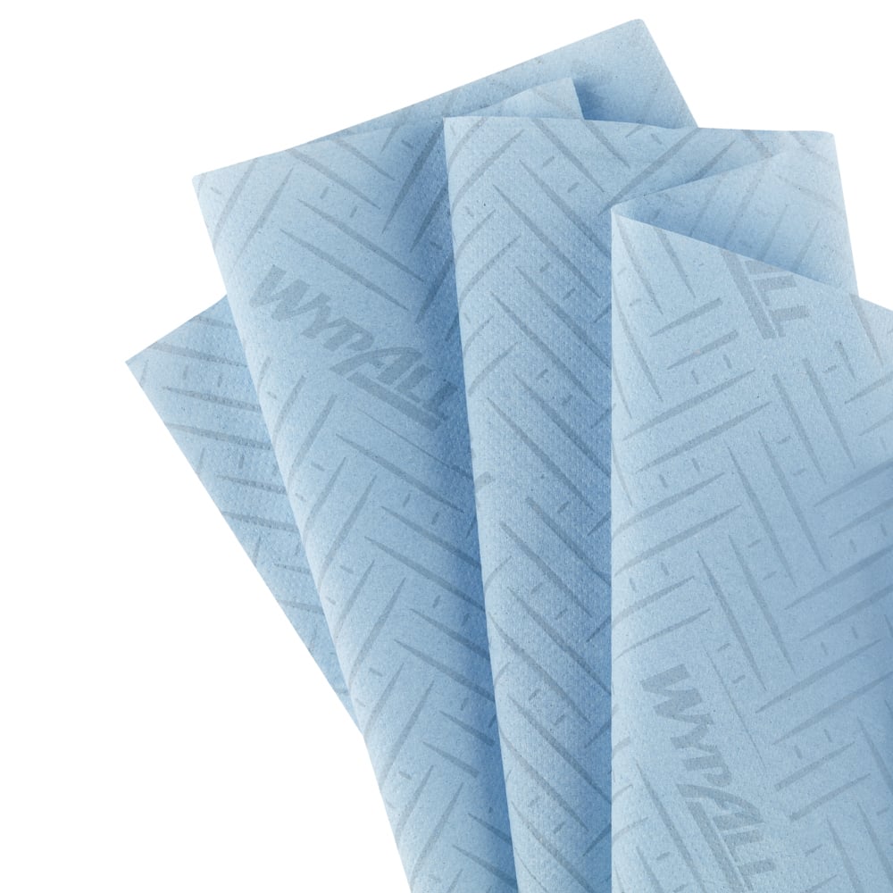 Six rolls of blue WypAll® Reach™ paper towel from Kimberly-Clark GmbH (6 x 280 sheets), arranged for cleaning in service & retail, ideal for central dispensing - nicely presented on a white background.