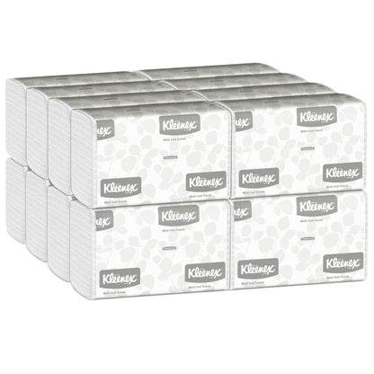 A carton with 16 packs of Kleenex® Hand Towels MultiFold White, each with the Kleenex logo and light gray pattern, by Kimberly-Clark GmbH - ideal for washrooms needing reliable multi-fold hand towels (16 x 150 sheets).