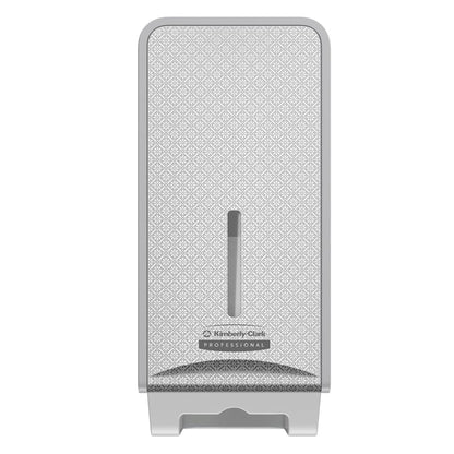 The Kimberly-Clark Professional™ Icon™ toilet paper dispenser (folded, 32x14.5x13.8 cm) by Kimberly-Clark GmbH is wall-mounted, has a patterned front, a vertical window for paper level, and a subtle logo - ideal for any washroom.