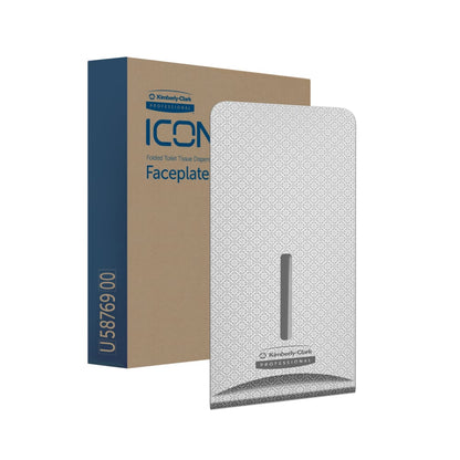 A patterned gray Kimberly-Clark Professional™ Icon™ Dispenser Faceplate - FTT (27.80 x 13.10 x 1.40 cm) by Kimberly-Clark GmbH stands in front of its packaging labeled "ICON Folded Toilet Tissue Dispenser Faceplate" and fits perfectly with any washroom decor.