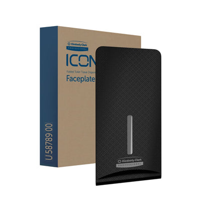 A black Kimberly-Clark Professional™ Icon™ Dispenser Faceplate - FTT (27.80 x 13.10 x 1.40 cm) by Kimberly-Clark GmbH is seen in front of the brown-blue packaging labeled "Folded Toilet Tissue Dispenser Faceplate," ideal for modern washrooms.