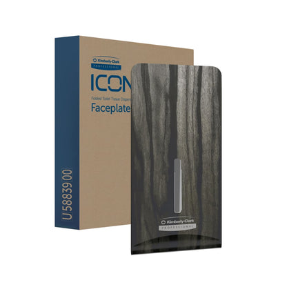 A brown box labeled "Kimberly-Clark Professional™ Icon™ Dispenser Faceplate - FTT" stands next to a dark, wood-textured faceplate (27.80 x 13.10 x 1.40 cm) with the logo of Kimberly-Clark GmbH - ideal for modern washroom design.