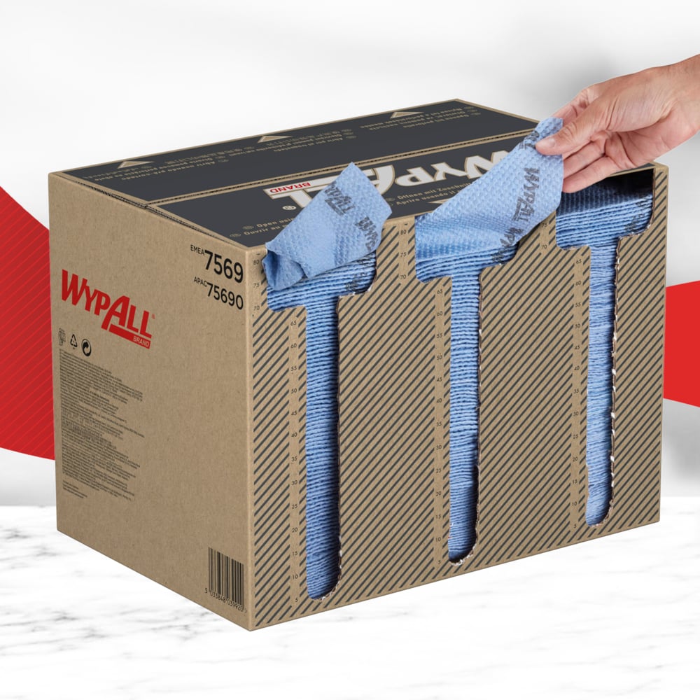 A hand pulls a blue WypAll® ForceMax wipe (33.50 x 34.50 cm) from a brown box with three openings on the front. Durable wipes from Kimberly-Clark GmbH for efficient industrial cleaning are revealed. Box contains 480 quarter-folded wipes.
