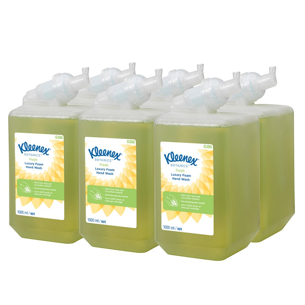 Six 1-liter cartridges of Kleenex® Botanics™ Luxury Foam Hand Wash from Kimberly-Clark GmbH, each with green liquid and white/green label, are arranged in two rows of three. Packaging: box with 6 cartridges.