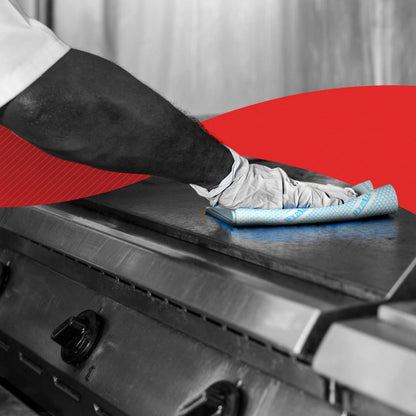 A person with white gloves wipes a metal surface with a blue WypAll® X80 Plus Critical Clean quarter-folded cloth (Kimberly-Clark GmbH). In the background, a red graphic can be seen.