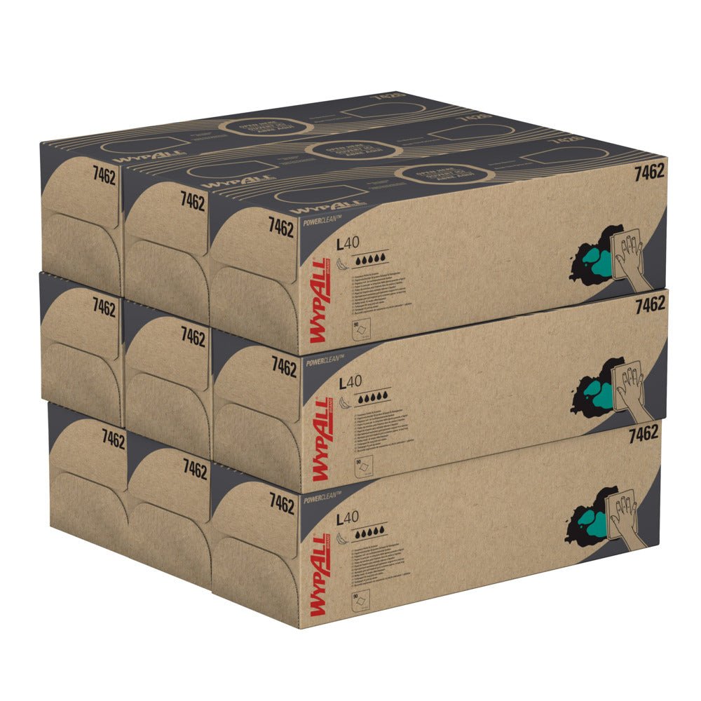 Pictured are four stacked pop-up box cartons with Kimberly-Clark WypAll® L40 PowerClean cloths, white (9 boxes x 90 cloths). Each box is adorned with a hand-with-cloth illustration and detailed product information on the side.