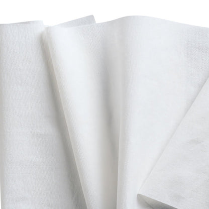 Several white napkins, like the WypAll® L40 PowerClean from Kimberly-Clark GmbH (9 cartons x 90 sheets), are arranged overlapping, highlighting their thin, light texture against a seamless white background.