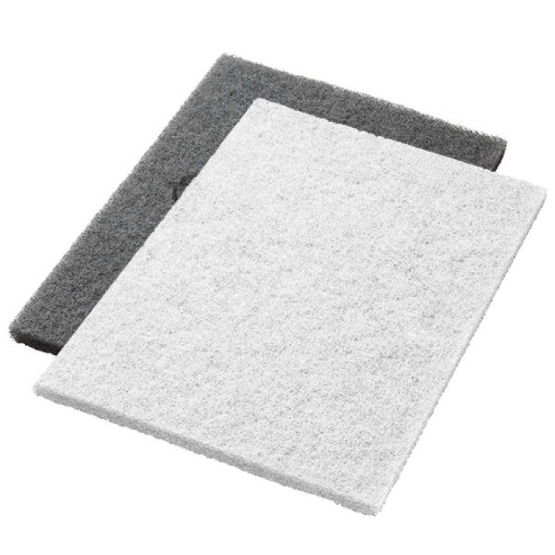 Two white Twister Pads from Diversey Deutschland GmbH & Co. OHG are depicted stacked crookedly. Each restoration pad is ideal for natural stone cleaning and stone floor restoration, offering a rough texture for effective cleaning. 2 pieces per package.