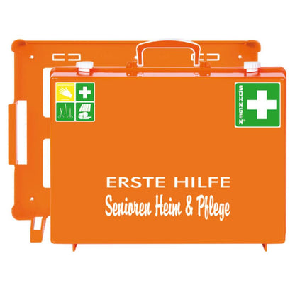 The orange First Aid Senior Home and Care MT-CD from W. Söhngen GmbH is a first aid kit with green crosses, white lettering "FIRST AID Senior Home & Care" and Aluderm® bandages for safety in the senior and care home. Package (1 piece).