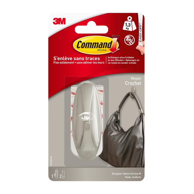 A package of the Command™ Medium Designer Hook in metal look (17081BN) from 3M Deutschland GmbH shows a sturdy hook holding a handbag. According to the packaging, it holds up to 1.3 kg and can be removed cleanly without leaving marks.