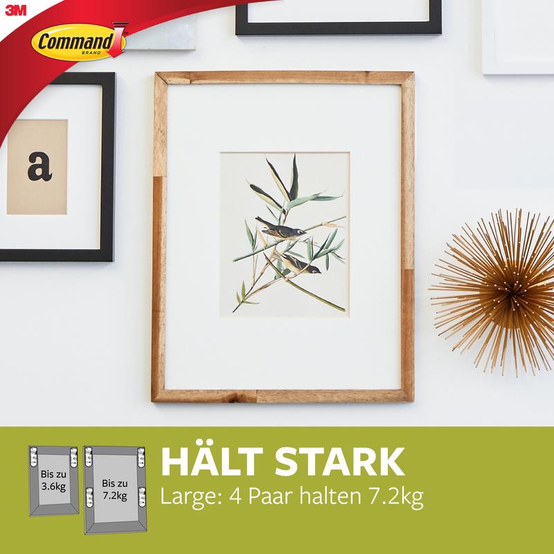 A wooden picture frame with a plant illustration is mounted on a white wall using Command™ Picture Hanging Strips L 17206 from 3M Deutschland GmbH. The text reads: "HOLDS STRONGLY Large: 4 pairs hold 7.2kg." The strips allow for damage-free hanging without nails.