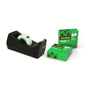 A 3M Deutschland GmbH Scotch™ C38 desktop tape dispenser in black holds a roll of Scotch® Magic™ Invisible Tape (19 mm x 33 m), next to it are two green packages each with three rolls on a white background.