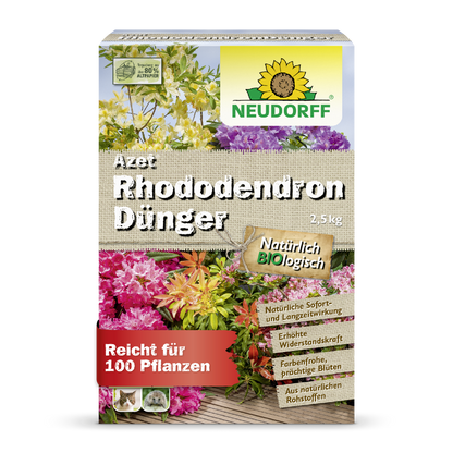 A 2.5 kg package of Neudorff Shop Azet Rhododendron Fertilizer, an organic fertilizer for rhododendrons and azaleas, with pictures of blooming flowers and German product details on the front of the packaging.