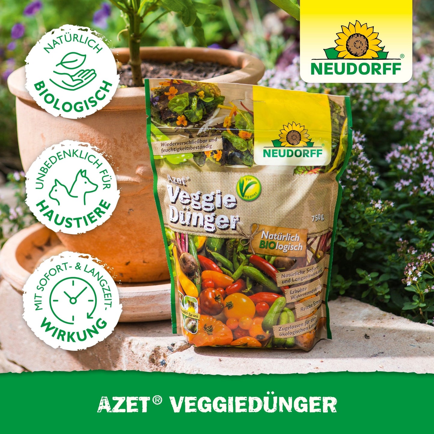A bag of Neudorff Shop Azet VeggieFertilizer stands on a wooden surface outdoors next to a terracotta pot with green plants. The packaging features vegetable images and certification logos.