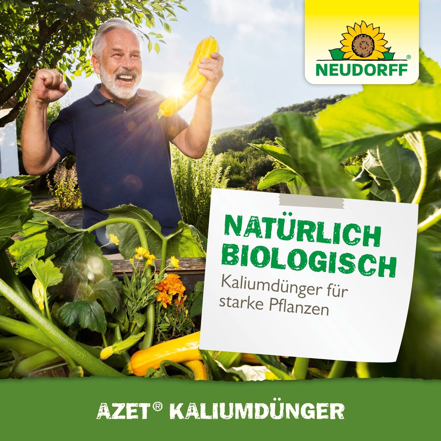 A gray-haired man stands in a garden, smiling and holding a yellow zucchini with a raised fist. A sign reads "Naturally organic, Azet Potassium Fertilizer for fertilizing strong plants." The Neudorff Shop branding is visible.